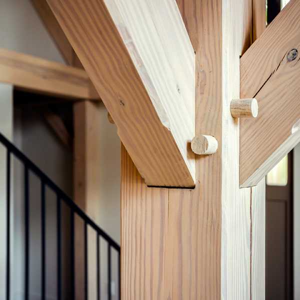 Traditional column joinery in a timber frame home.