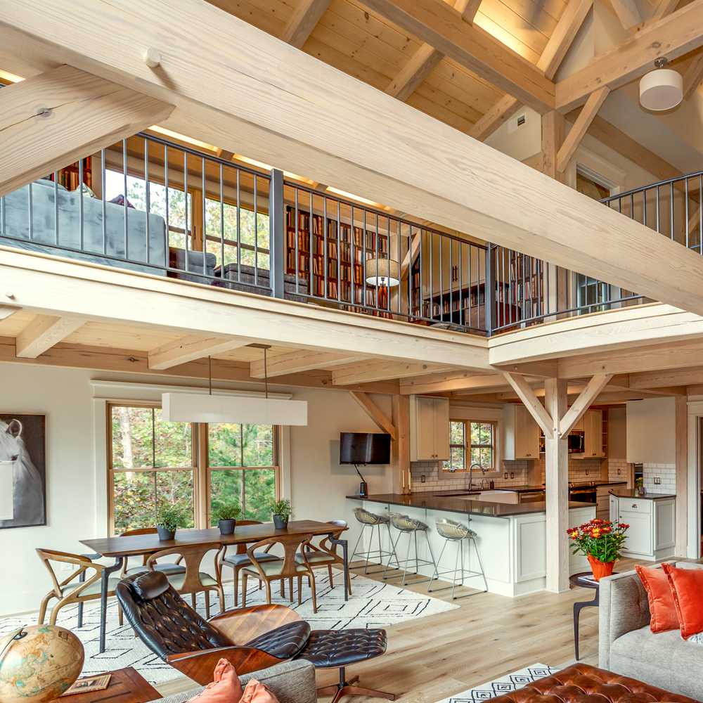 The living room of a timber frame home, which showcases the building's structure.